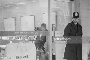 A police officer patrolling the Bag One exhibition by John Lennon at the London Arts Gallery on New Bond Street after the Scotland Yard confiscated 14 drawings for obscene depictions, London, UK, 16th January 1970. (Photo by Evening Standard/Hulton Archive/Getty Images)